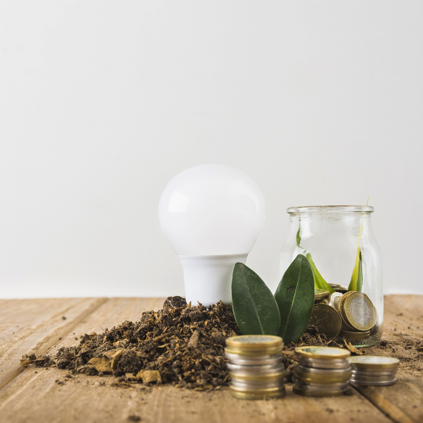 https://doyengreenx.com/wp-content/uploads/2024/09/light-bulb-with-glass-jar-coins-stacks.jpg